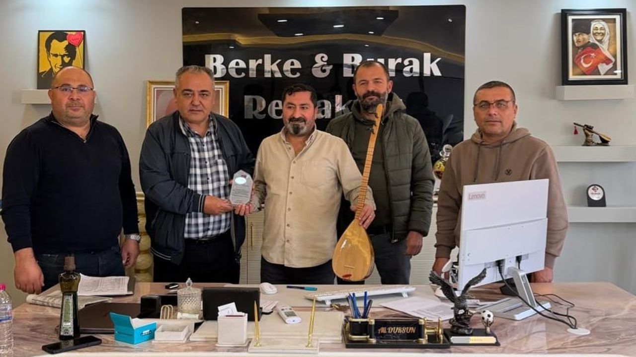 Ali Dursun’a cura ve plaket