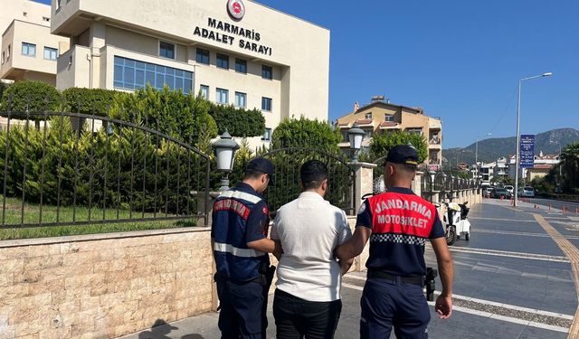 Kadın şüpheli erkek kılığında yakalandı